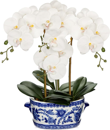White faux orchid in blue and white porcelain pot