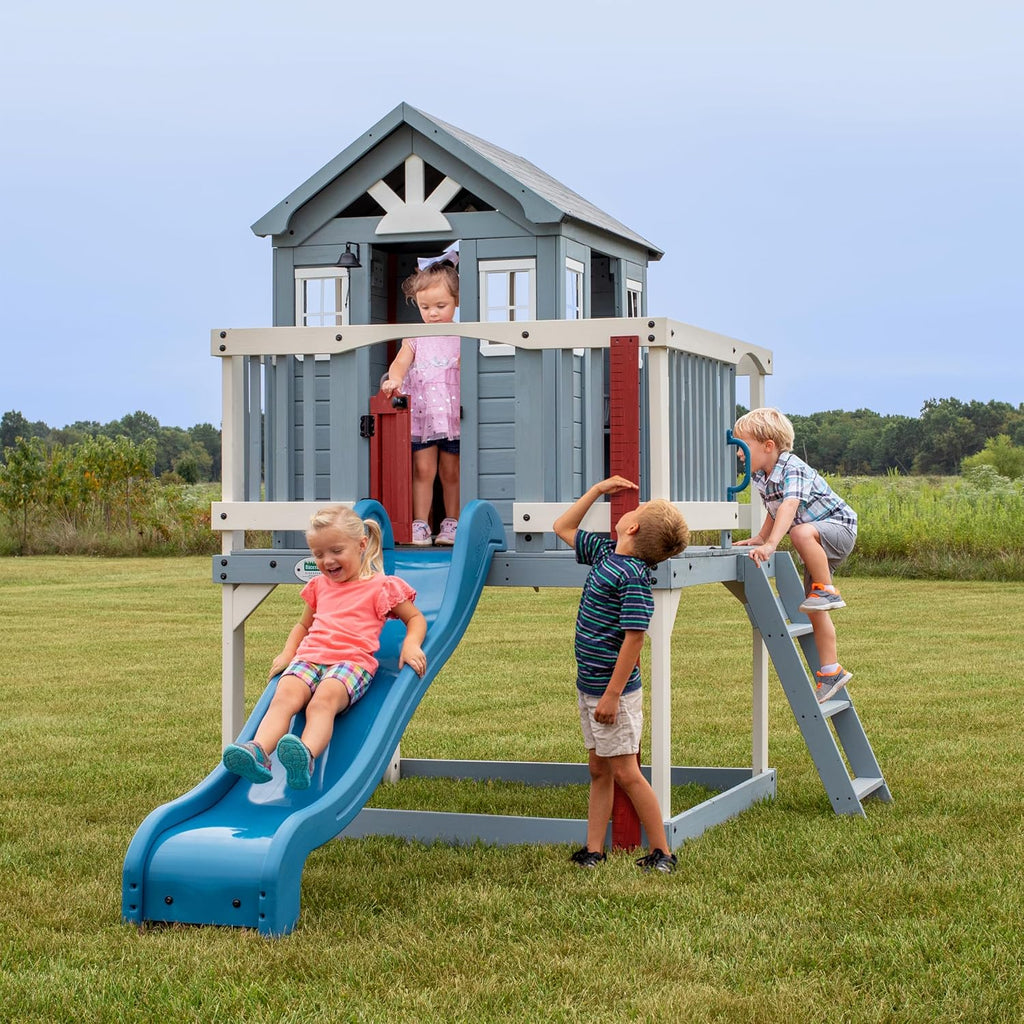 Beacon Heights Elevated Cedar Wooden Kids Playhouse with Wave Slide, Play Kitchen, Wrap-Around Deck, Flat-Step